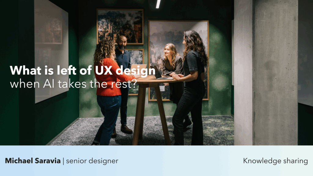 A group of UX designers discussing ideas around a high table in a modern office